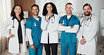 Healthcare, portrait and doctors in hospital with nurses, medical team and arms crossed with integrity. People, confident and employees in clinic for service, medicare about us and happy in group