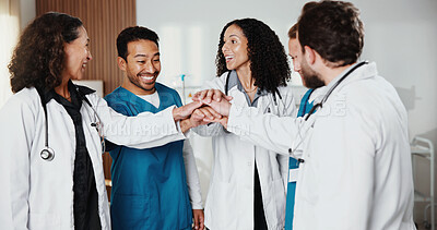 Buy stock photo Doctors, nurses and hands together in hospital for healthcare, teamwork or support for medicare. People, excited and medical workforce in clinic with collaboration, service or cooperation with huddle
