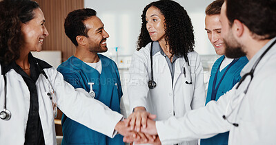 Buy stock photo Doctors, nurses and hands together in clinic for healthcare, teamwork or support for medicare. People, happy or medical workforce in hospital with collaboration, service or cooperation with huddle