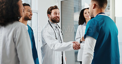 Buy stock photo Doctor, nurse and handshake in hospital with welcome, onboarding and introduction to medical team. Healthcare worker, happy people and shaking hands in clinic with new recruit, greeting or discussion
