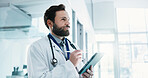 Thinking, man and doctor with tablet in hospital for telehealth, service or medical advice. Digital technology, planning and healthcare worker with online consultation, research or patient report.
