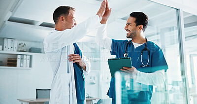 Buy stock photo Doctor, nurse and high five in clinic with tablet, medical research success and collaboration goals. Happy, men and celebration in hospital with tech, achievement and partnership for healthcare team.