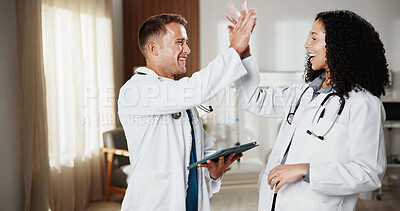 Buy stock photo Healthcare, high five and tablet with doctors in hospital together for celebration of goals or success. App, collaboration and target with excited medical people in clinic for support or wellness