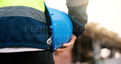 Buy stock photo Construction, helmet or hand on site with safety, protection gear or equipment in building project. Man, back or hardhat for risk control, ppe compliance or hazard prevention in industrial industry.