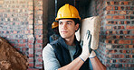 Architect, man and wood plank with helmet on construction site for building progress or development. Male person, civil engineer or contractor carrying lumber material for architecture or project