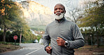 Serious, man and running on road, exercise and endurance for physical activity or cardio for fitness. Outdoor, mature runner and black person on street, training and workout routine to lose weight