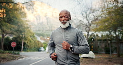 Buy stock photo Serious, man and running on road, training and endurance for physical activity or cardio for fitness. Outdoor, mature runner and black person on street, wellness and workout routine to lose weight