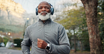 Buy stock photo Fitness, headphones and running with black man outdoor for cardio training or workout routine. Exercise, happy and music with mature runner in neighborhood for challenge, development or streaming