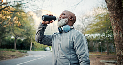 Buy stock photo Drinking water, fitness and headphones with black man outdoor for training or workout break. Exercise, hydration and music with mature runner in neighborhood for cardio challenge or streaming