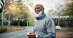 Fitness, portrait and smile of black man outdoor for hydration, training or workout routine. Exercise, happy and headphones with mature runner in neighborhood for break, cardio challenge or streaming