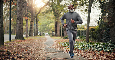 Buy stock photo Active, man and running on road, fitness and endurance for physical activity or cardio for wellness. Serious, mature runner and outdoor for exercise, black person and workout routine to lose weight