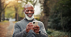Outdoor, earphones and man with phone, exercise and watching funny fitness tutorial on social media. Mature runner, laughing and black person with mobile on workout break, online and streaming music