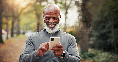 Buy stock photo Fitness, earphones and man with phone, laughing and watching funny exercise tutorial on social media. Happy, mature runner and black person with mobile on workout break, online and streaming music