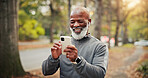 Fitness, earphones and man with phone, online or watching funny workout tutorial on social media app. Happy, mature runner and black person with mobile on exercise break, laughing and streaming music