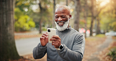 Buy stock photo Fitness, earphones and man with phone, online or watching funny workout tutorial on social media app. Happy, mature runner and black person with mobile on exercise break, laughing and streaming music