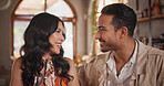 Happy, talking and couple in restaurant for date, bonding and romantic dinner for anniversary. Love, fine dining and man with woman for communication, conversation and connection for relationship