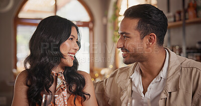 Buy stock photo Happy, talking and couple in restaurant for date, bonding and romantic dinner for anniversary. Love, relationship and man with woman for communication, conversation and connection for commitment