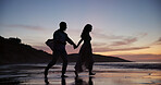 Couple, walking and holding hands at beach with smile, travel and romantic date on holiday. Silhouette, sunset or people at seashore with space, commitment and tropical vacation for adventure getaway