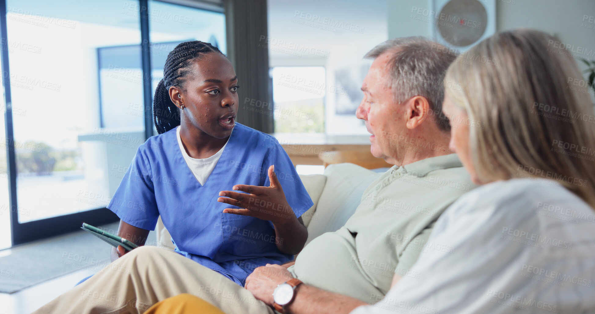 Buy stock photo Caregiver, elderly couple and consultation in home with tablet, healthcare insurance or medical aid. Retirement, man or woman with nurse for wellness coverage, feedback or policy discussion with tech