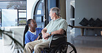 Nurse, old man and wheelchair with conversation for senior care, wellness and health in home. Caregiver, person with disability and talking for assistance, helping hand and support for homecare
