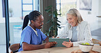Happy, nurse and old woman in home with tablet, reading test results and good news for health checkup. Senior person, caregiver and smile in house with tech, help and positive feedback for diagnosis.