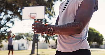 Buy stock photo Hands, person and wrist pain with injury on basketball court for exercise, fitness or training accident. Park, sports athlete and massage muscle for fibromyalgia, arthritis or health problem outdoor
