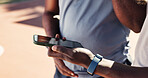 Fitness, app and phone with hands of people in park for message, tracker and social media. Summer, communication and training with friends in nature for health, tech and workout planning outdoor
