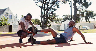 Buy stock photo Basketball court, help and black man with leg accident, pain or support with first aid outdoor. Game, African friends and player with sports injury on ground for fitness, training and muscle cramp
