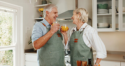 Buy stock photo Senior, couple and cooking in kitchen with orange juice, funny joke and healthy diet for retirement. Happy, married old man and woman in home with drink, meal preparation and humor for connection.
