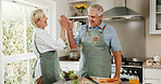 Senior, couple and cooking in kitchen with high five, bonding together and laugh for funny joke. Happy, married elderly people and celebration in house for meal prep, humor and healthy nutrition.