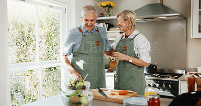 Buy stock photo Senior, couple and cooking in kitchen with laugh, retirement wellness and funny joke for bonding. Happy, married elderly people and meal prep in home with healthy food, love and humor for connection.