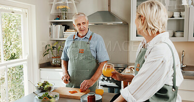 Buy stock photo Cooking, food and old couple in kitchen with orange juice, discussion and wellness for retirement. Married, senior people and conversation in home with drink, nutrition and vegetables for meal prep.