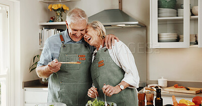 Buy stock photo Cooking, hug and old couple in kitchen with laugh, funny joke and healthy food for retirement wellness. Happy, married senior people and embrace in home with love, humor or meal prep for lunch recipe