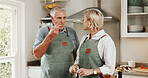 Cooking, tasting and old couple in kitchen with help, connection and bonding with meal prep. Retirement, food sampling and elderly people with spoon, healthy relationship or culinary hobby in home.