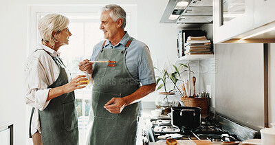 Buy stock photo Cooking, smile and senior couple in kitchen with support, happy moment or bonding with meal prep. Retirement, partner or elderly people with culinary hobby, healthy relationship or connection in home