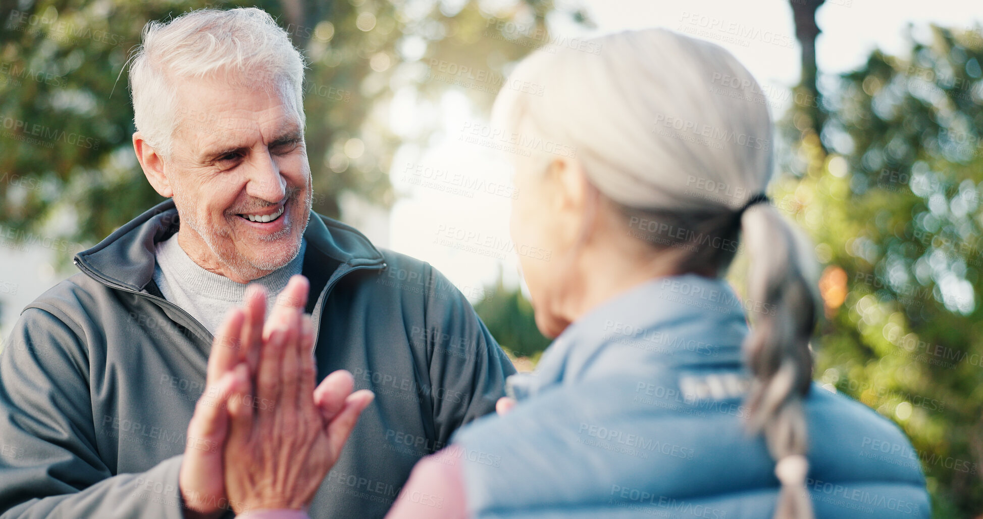 Buy stock photo Fitness, high five and smile of old couple outdoor together for training goals, success or target. Celebration, flare and motivation with happy seniors in park for exercise achievement or milestone