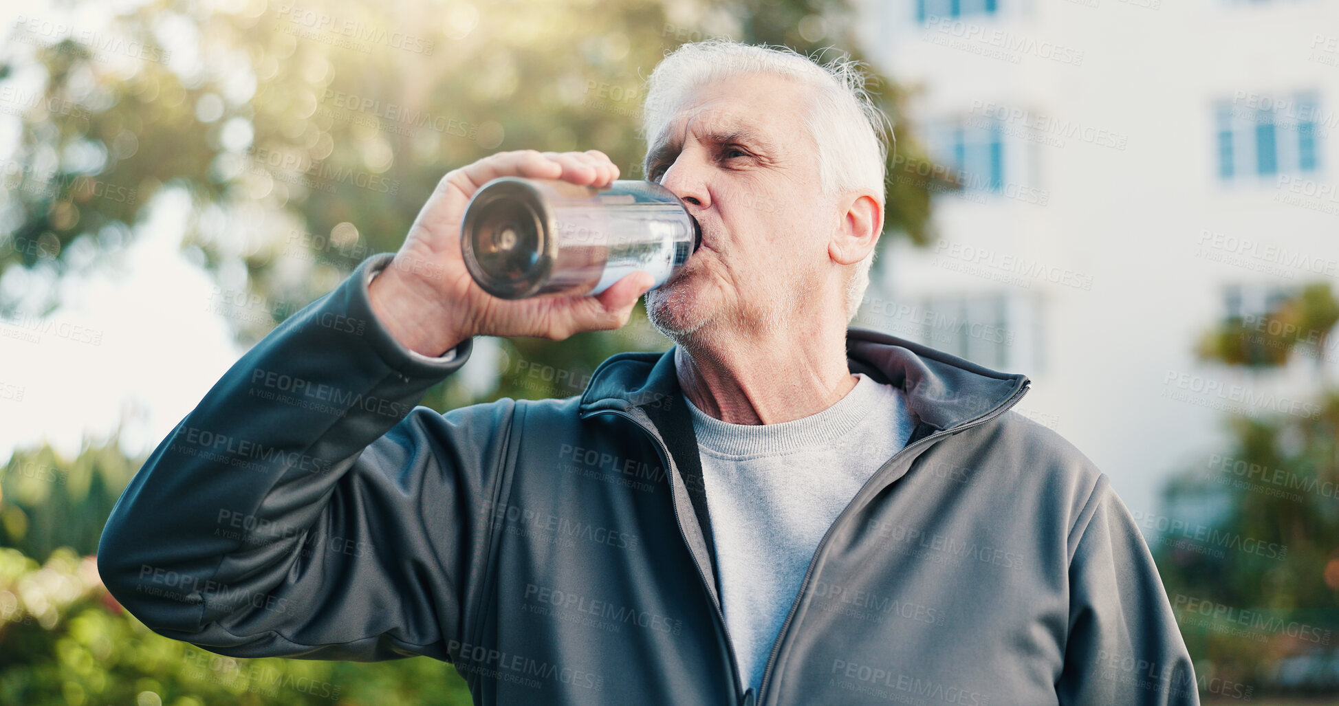 Buy stock photo Fitness, drink and senior man in city for rest, workout recovery and hydration with bottle. Exercise break, active retirement and person with water for health, beverage and thirsty with runner