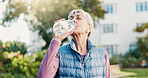 Fitness, drink and senior woman in city for rest, workout recovery and hydration with bottle. Exercise break, active retirement and person with water for health, beverage and thirsty with runner
