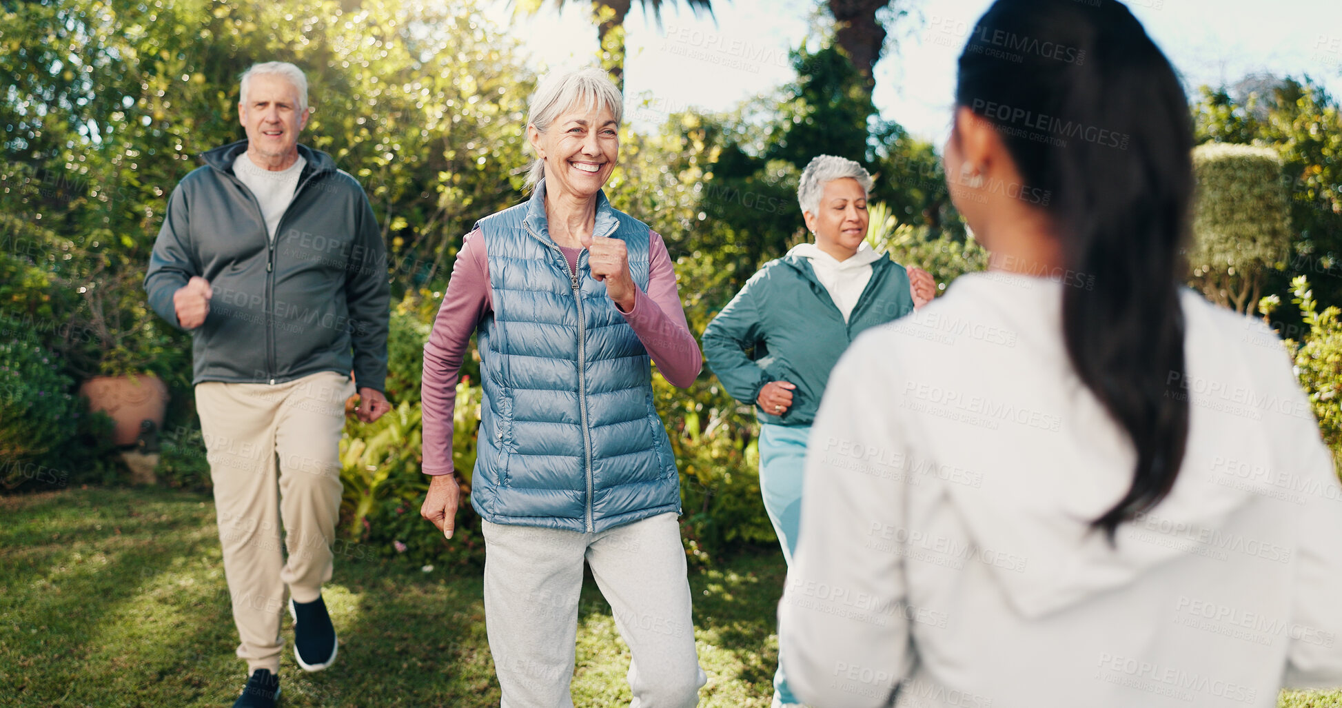 Buy stock photo Fitness, class and old people outdoor with personal trainer, exercise together or smile for wellness. Workout coach, senior group and happy in garden with cardio, guidance and retirement activity.