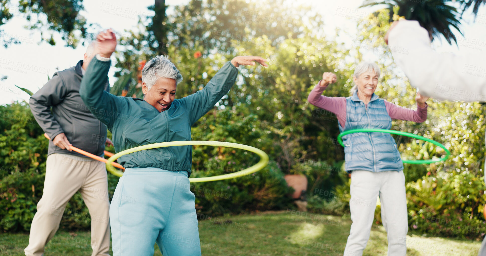 Buy stock photo Friends, elderly people and hoop in park for fitness, body mobility and outdoor for wellness. Happy, senior group and toy plastic ring for training, warm up exercise or retirement health in nature