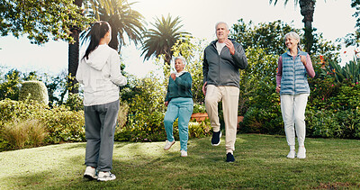 Buy stock photo Exercise, class or old people outdoor with personal trainer, movement together or smile for wellness. Fitness coach, senior group and happy in garden with cardio workout, guidance or retirement club.