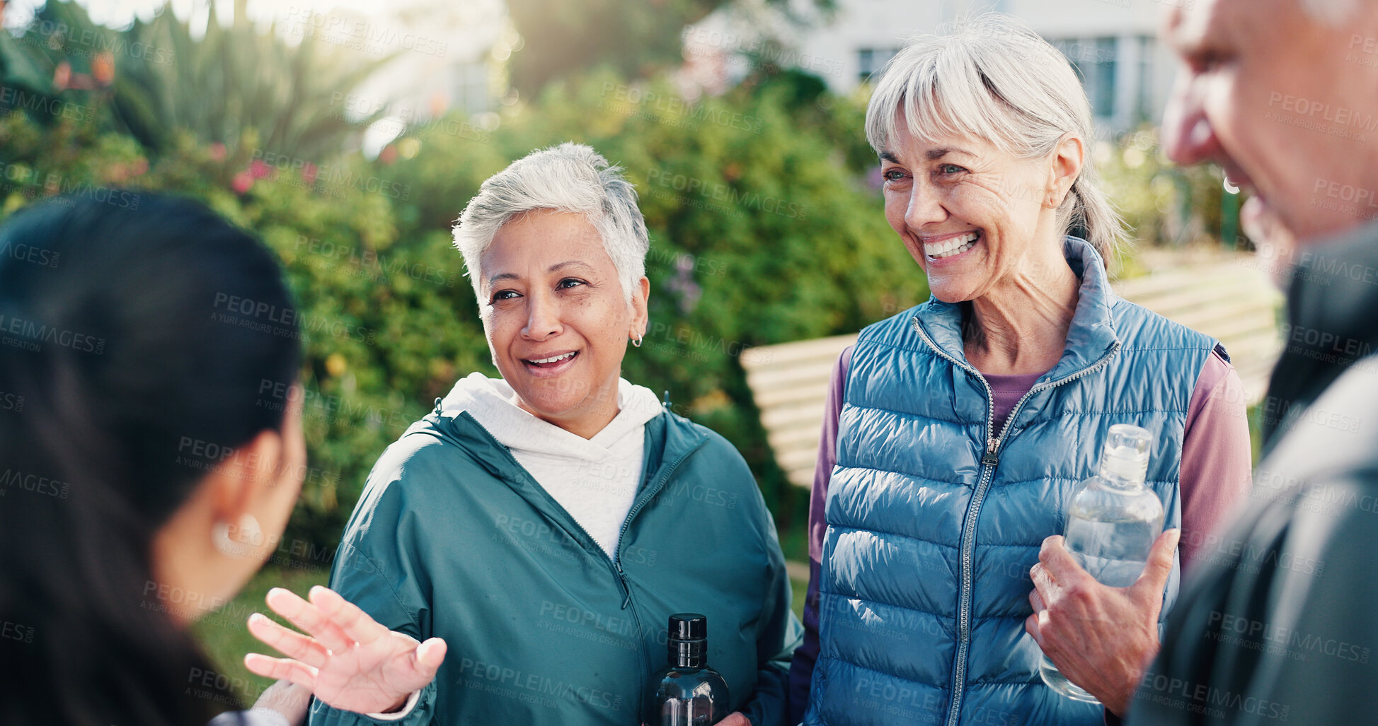 Buy stock photo Senior, people and conversation outdoor with personal trainer, questions and advice for wellness. Happy, old friends and fitness coach by retirement home with garden, discussion or tips for vitality.