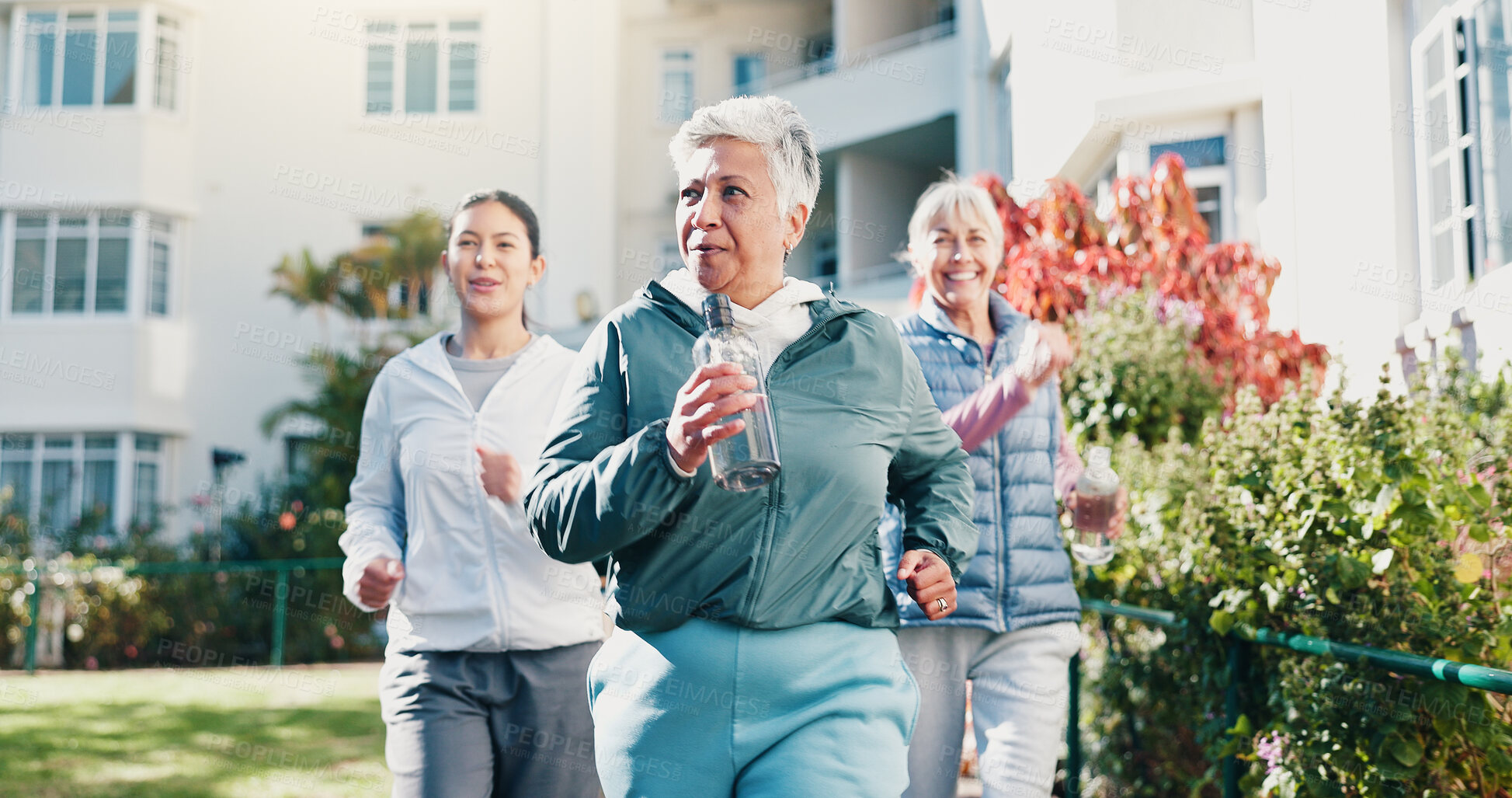 Buy stock photo Woman, outdoor and senior people with personal trainer, workout together and movement for wellness. Fitness coach, pensioner group and walk by retirement home with exercise, breathing and guidance.