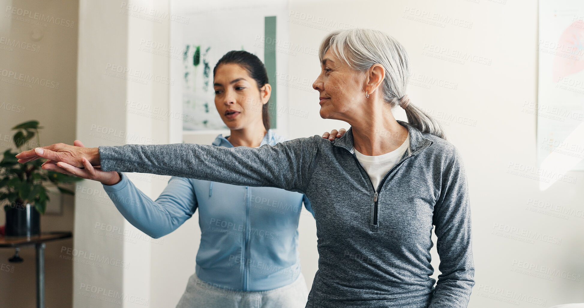 Buy stock photo Physio, old woman and stretching in office for checkup, assessment and recovery from injury. Physiotherapist, helping and senior person at clinic for physiotherapy, evaluation and healing arthritis