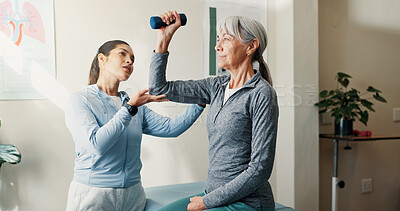 Buy stock photo Consulting, rehabilitation and weights with women in session together for exercise or healing. Dumbbell, fitness and physiotherapy of senior person with chiropractor in health clinic for recovery