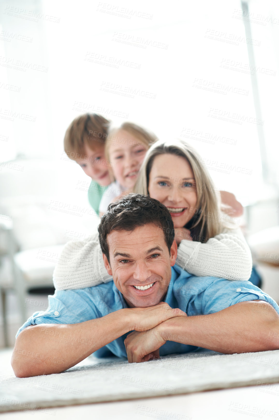 Buy stock photo Floor, smile and portrait of kids with parents in home for bonding, love and care on weekend. Happy, relax and children with mom and dad on carpet for family, safety or connection in living room.
