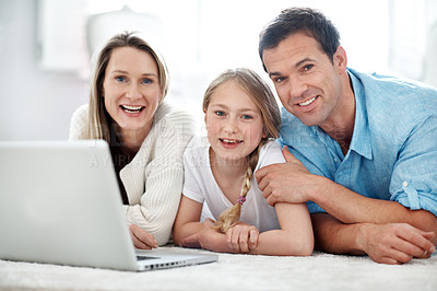 Buy stock photo Parents, portrait and child with laptop in home, smile and streaming film with subscription on floor. Online, movie and happy people with kid, family and relax with tech for entertainment in house