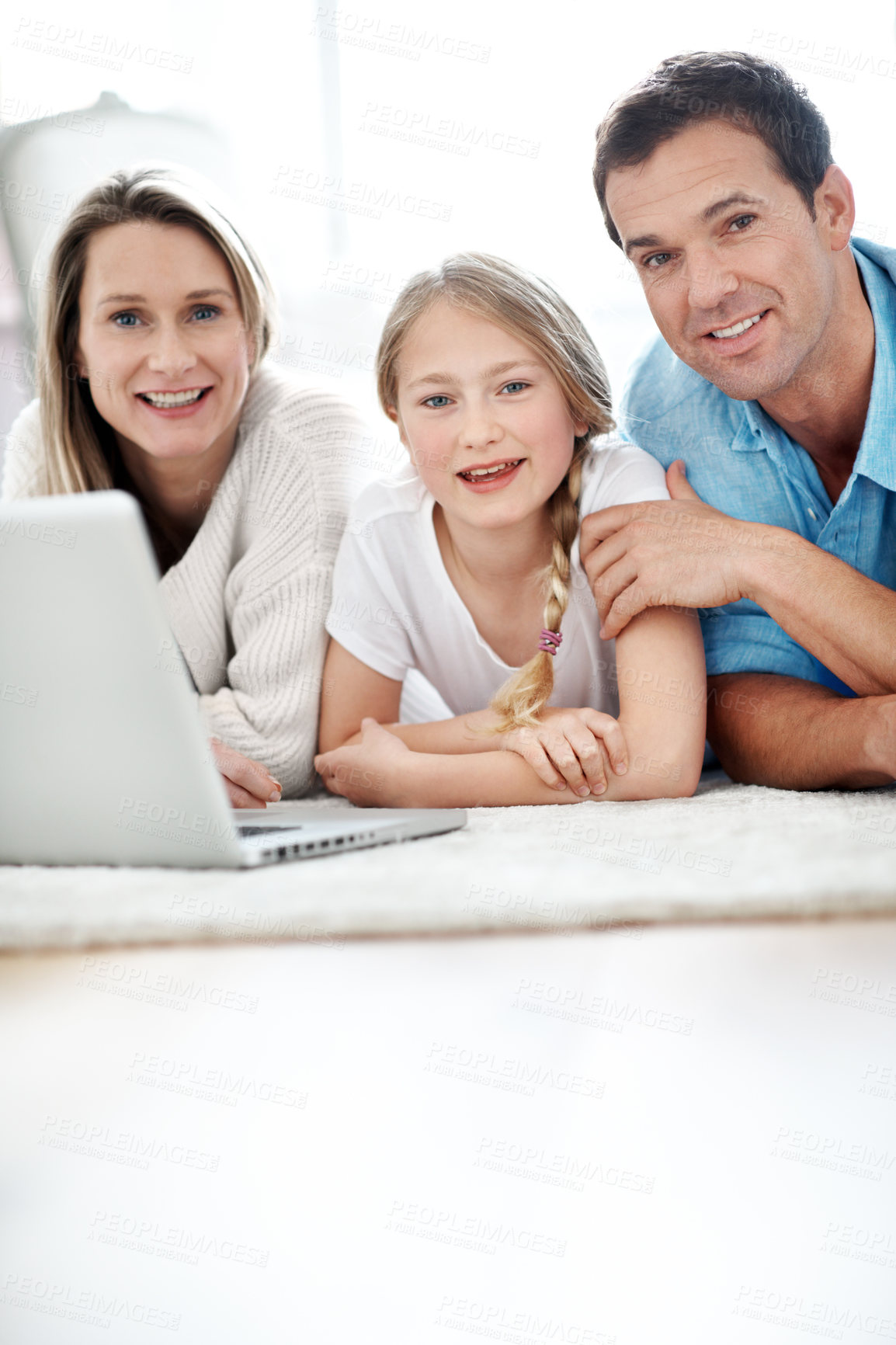 Buy stock photo Parents, portrait and child with laptop on floor, smile and streaming film with subscription in home. Online, movie and happy people with kid, family and relax with tech for entertainment in house