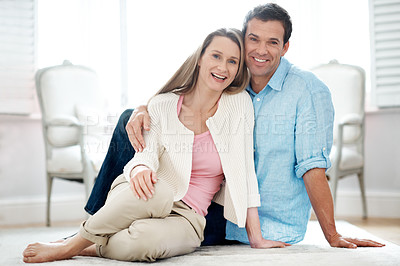 Buy stock photo Happy, portrait and couple on floor in home for break, relax and bonding on weekend together. Marriage, smile and man with woman in living room for relationship, connection and embrace for affection