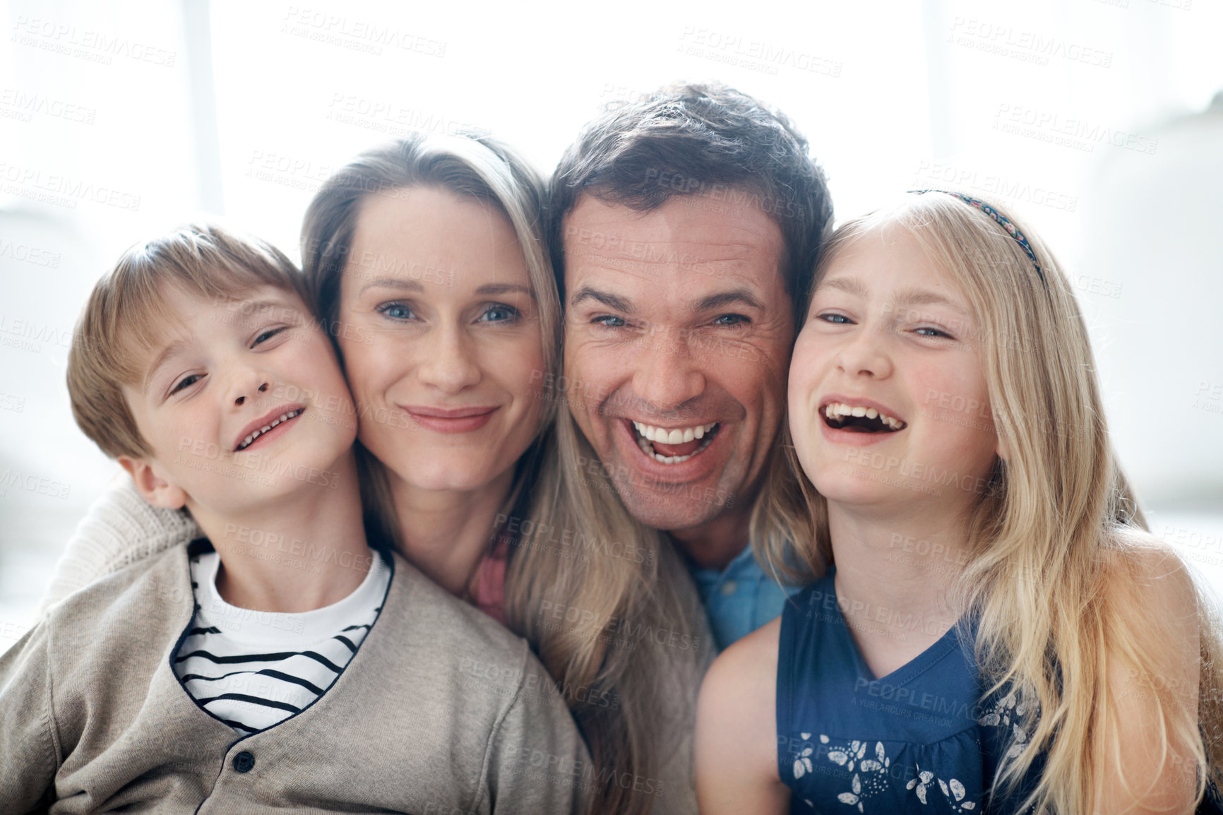 Buy stock photo Portrait, parents and relax at house with kids, love and parental support for bonding together. Smile, people and laughing in lounge with children, comfortable and family connection for weekend break